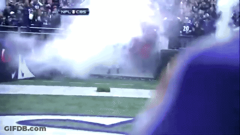 A Football Game Is Being Played On Cbs And Smoke Is Coming Out Of The Stands GIF