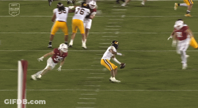 A Football Game Is Being Played On Espn College GIF