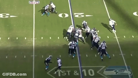 A Football Game Is Being Played On The 1St And 10 Yards GIF