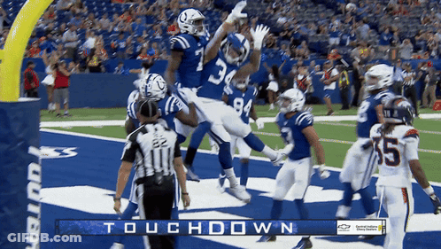 A Football Game Is Being Played With The Words Touchdown On The Bottom GIF