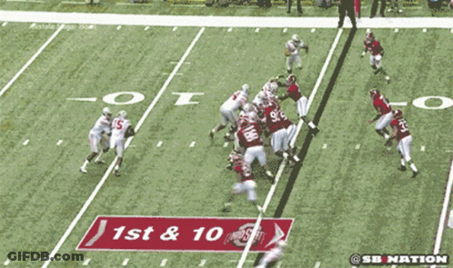 A Football Game Is Being Shown On Espn With A Crowd Watching GIF