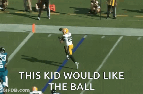 A Football Player Catching A Ball With The Words This Kid Would Like The Ball GIF