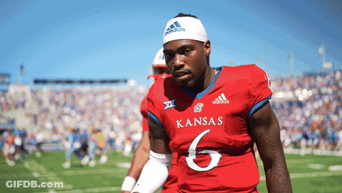 A Football Player For The Kansas Team Wears A White Adidas Headband GIF