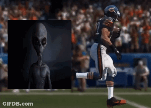 A Football Player In A Bears Uniform Is Kicking The Ball GIF