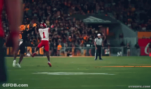 A Football Player In A Black Jersey With The Number 0 On It GIF
