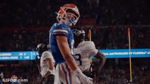 A Football Player In A Blue Jersey With The Number 1 On The Back GIF