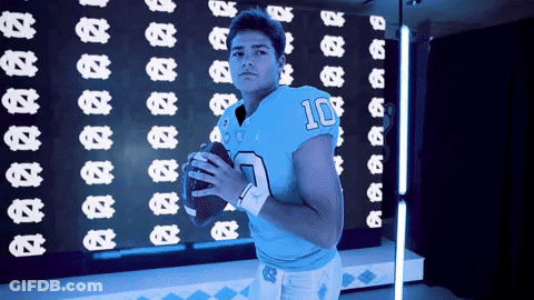 A Football Player In A Blue Jersey With The Number 10 On It GIF