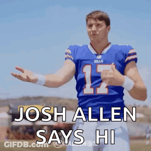 A Football Player In A Blue Jersey With The Number 12 On It Is Giving A Thumbs Up . GIF