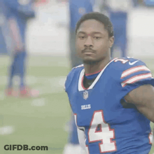 A Football Player In A Blue Jersey With The Number 4 On It GIF