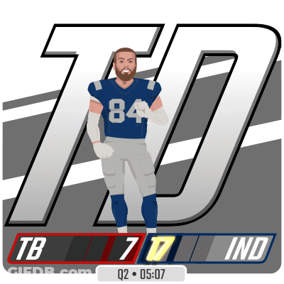A Football Player In A Blue Jersey With The Number 84 On It GIF