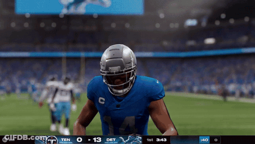 A Football Player In A Blue Uniform With The Number 14 On It GIF