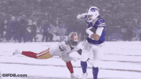 A Football Player In A Buffalo Bills Jersey Is Running With The Ball GIF