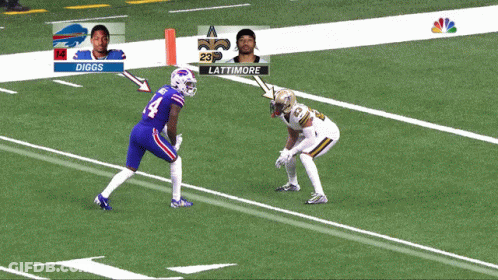 A Football Player In A Buffalo Bills Uniform Is Being Tackled GIF