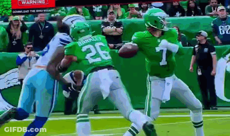 A Football Player In A Green Uniform With The Number 26 On It GIF