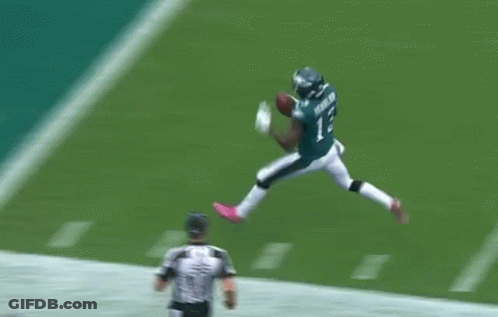A Football Player In A Green Uniform With The Number 8 On It GIF