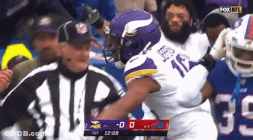 A Football Player In A Purple Jersey With The Number 17 On It GIF