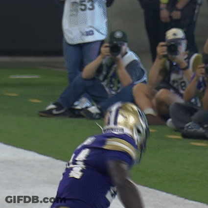 A Football Player In A Purple Jersey With The Number 53 On The Back GIF