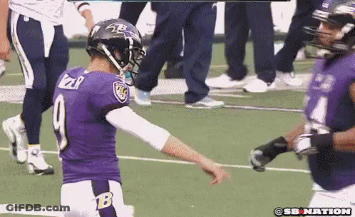 A Football Player In A Purple Uniform With The Number 9 On It GIF