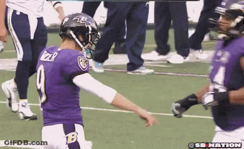 A Football Player In A Purple Uniform With The Number 9 On The Back GIF