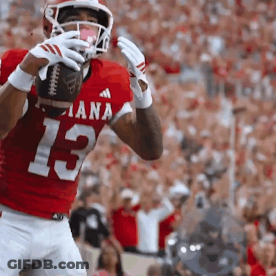 A Football Player In A Red Jersey With The Number 13 GIF
