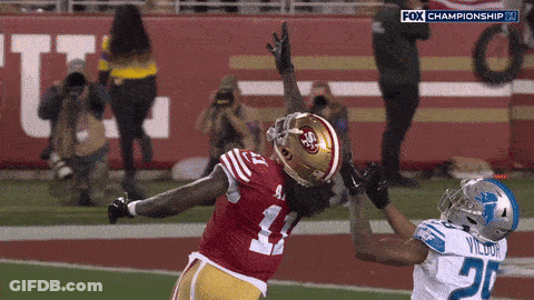 A Football Player In A Red Jersey With The Number 41 On It GIF