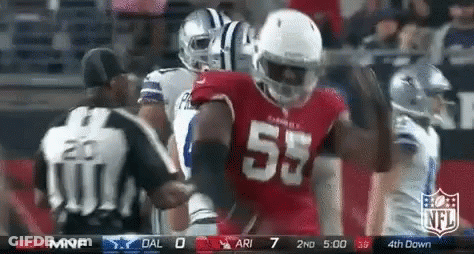 A Football Player In A Red Jersey With The Number 55 On It GIF