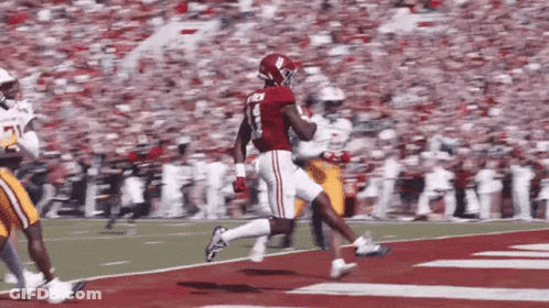 A Football Player In A Red Jersey With The Number 8 On It GIF
