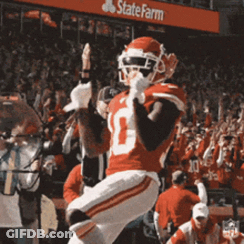 A Football Player In A Red Uniform With The Number 10 On His Jersey GIF