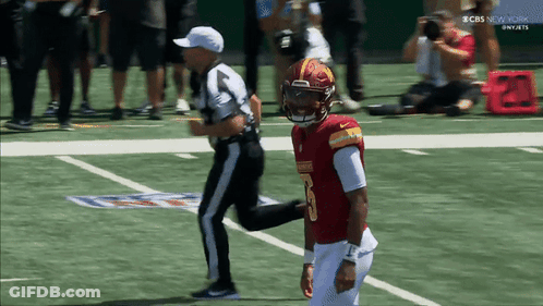 A Football Player In A Red Uniform With The Number 5 On It GIF