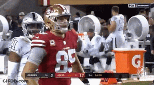 A Football Player In A Red Uniform With The Number 85 On It GIF