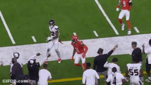 A Football Player In A White Jersey With The Number 12 On It GIF