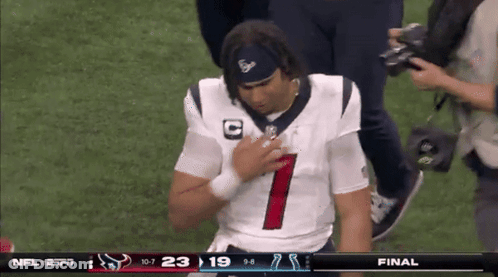A Football Player In A White Jersey With The Number 7 On It GIF