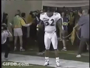 A Football Player In A White Uniform With The Number 32 On It GIF