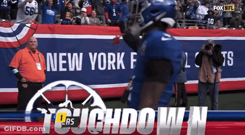 A Football Player In Front Of A Banner That Says Fox Nfl GIF
