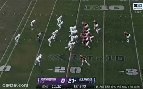 A Football Player Is Being Carried Off The Field By A Nurse . GIF