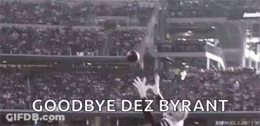 A Football Player Is Catching A Ball In A Stadium With The Words `` Goodbye Dez Bryant '' . GIF