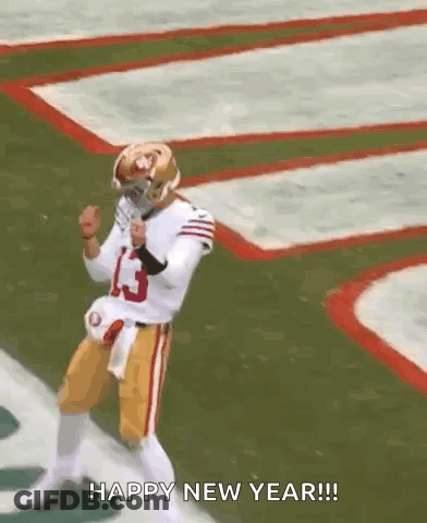A Football Player Is Dancing On A Field With The Words `` Happy New Year '' Written Below Him . GIF
