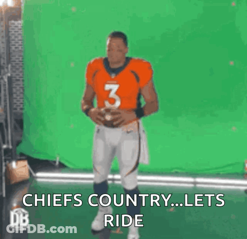 A Football Player Is Holding A Football In Front Of A Green Screen And Says Chiefs Country ... Lets Ride . GIF