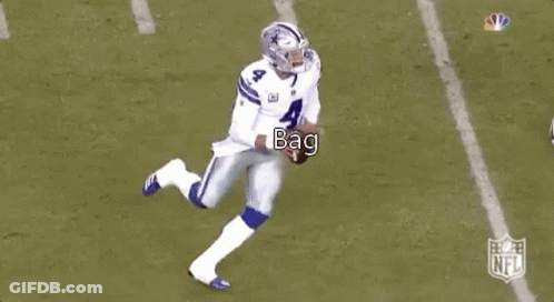 A Football Player Is Kneeling Down On The Field While Another Player Runs Behind Him . GIF