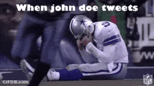 A Football Player Is Kneeling Down On The Field With His Head Down . GIF
