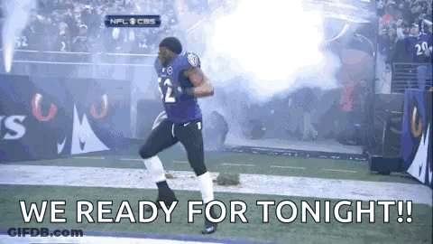 A Football Player Is Running On A Field With The Words `` We Ready For Tonight '' Written On It . GIF