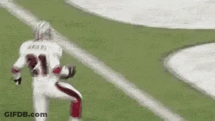 A Football Player Is Running On The Field While Wearing A Number 21 Jersey . GIF