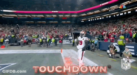 A Football Player Is Running On The Field With The Words Touchdown Written On The Bottom . GIF