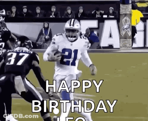 A Football Player Is Running With The Ball On A Field While Another Player Tries To Stop Him . GIF
