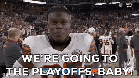 A Football Player Is Standing In Front Of A Crowd And Saying `` We 'Re Going To The Playoffs , Baby ! '' GIF