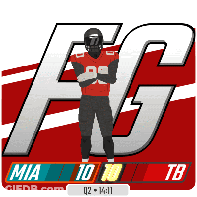A Football Player Is Standing In Front Of A Large F On A Red And White Background GIF