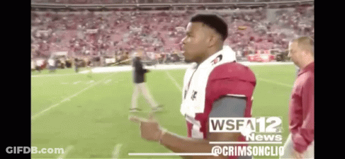 A Football Player Is Standing On A Field With A Wsfa12 News Logo On The Bottom GIF
