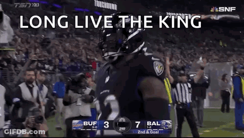 A Football Player Is Standing On A Field With The Words `` Long Live The King '' On The Screen . GIF
