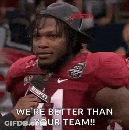 A Football Player Is Talking Into A Microphone And Says `` We 'Re Better Than Your Team ! '' GIF
