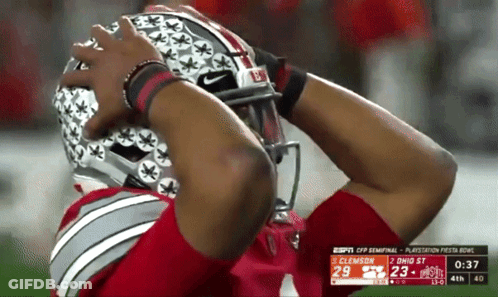 A Football Player Is Wearing A Helmet That Says Buckeyes On It GIF
